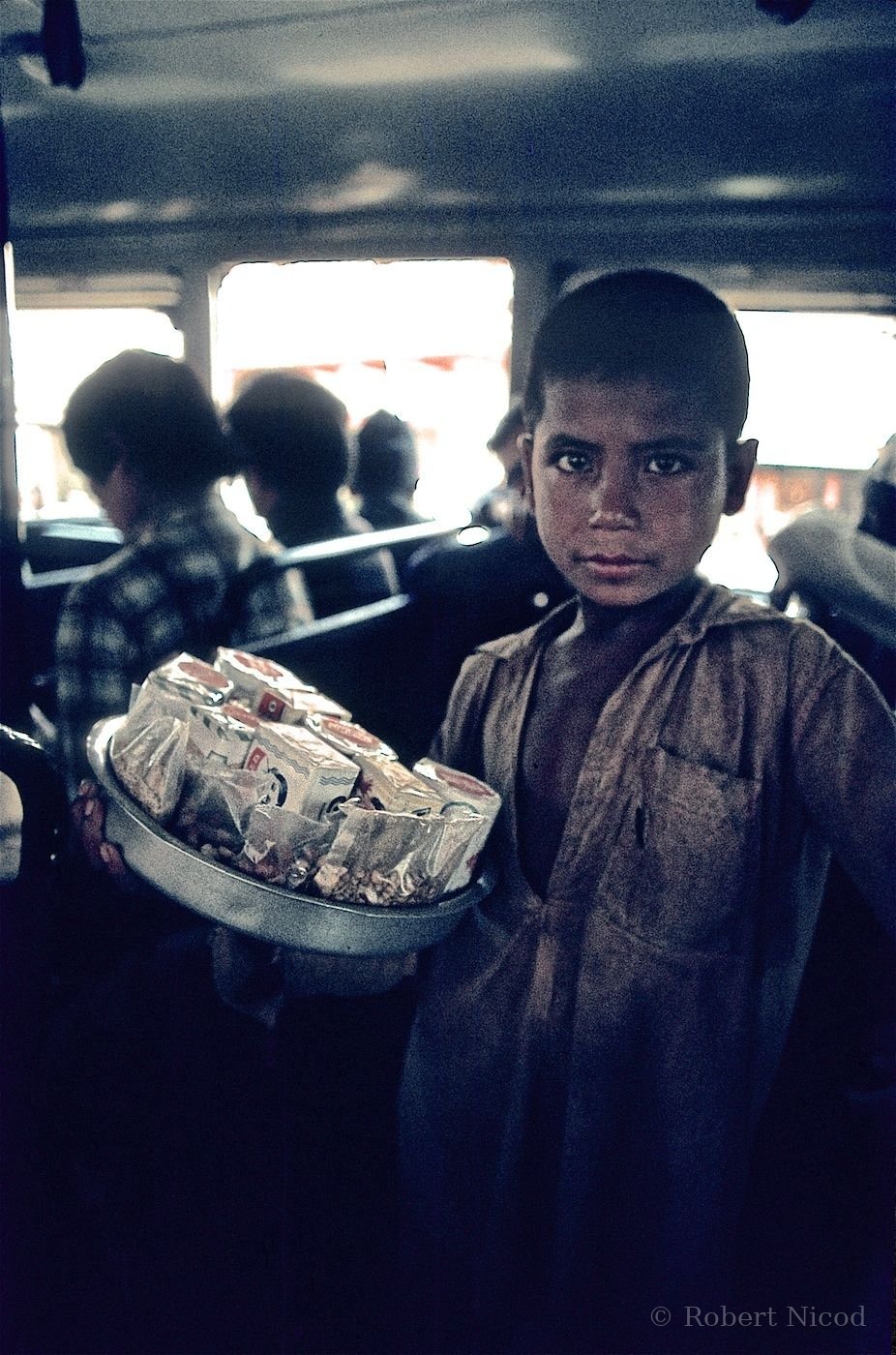 Nepal 1977 — Child vendor who climbed into the bus during a stop, Kathmandu to Pokhara road 1977