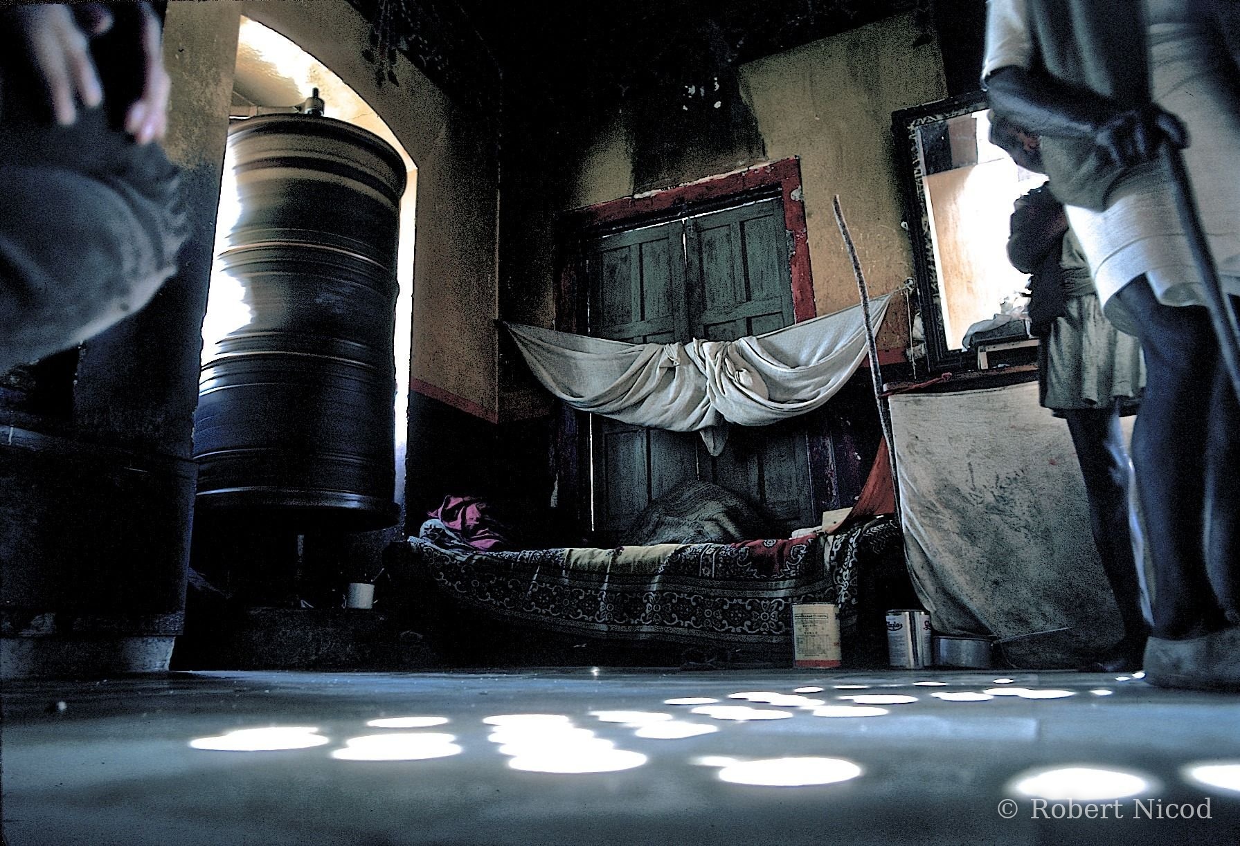Nepal 1977 — Prayer wheel in a niche open to the outside and to the keeper's room, Kathmandu 1977