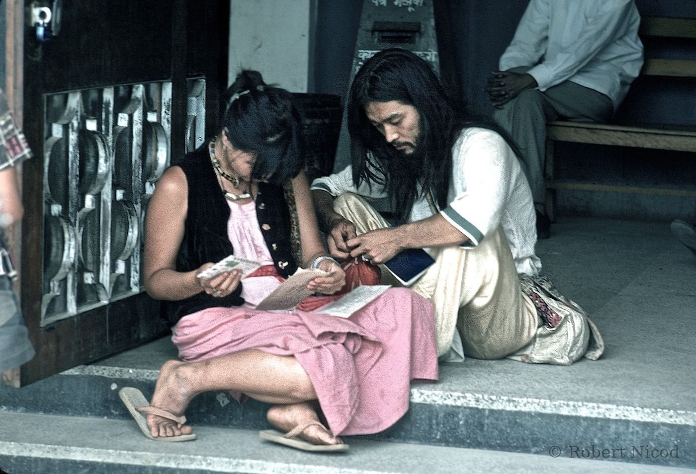 Tourists in Asia — Reading mail received “poste restante”, Kathmandu Post Office 1977