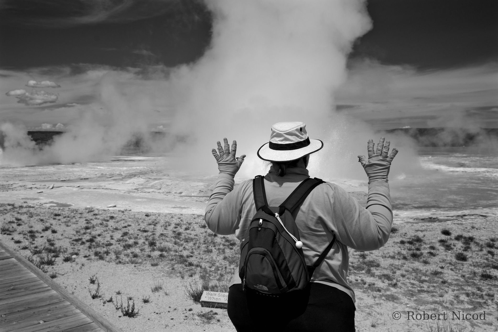 Tourists in the West — Hands held out to the heat, Yellowstone, Wyoming