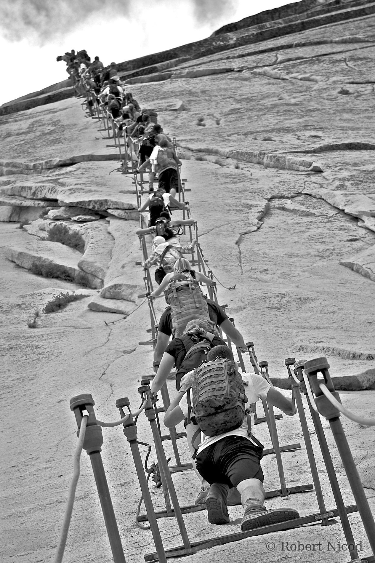 Tourists in the West — Rush to the summit, Half Dome, Yosemite Valley, California