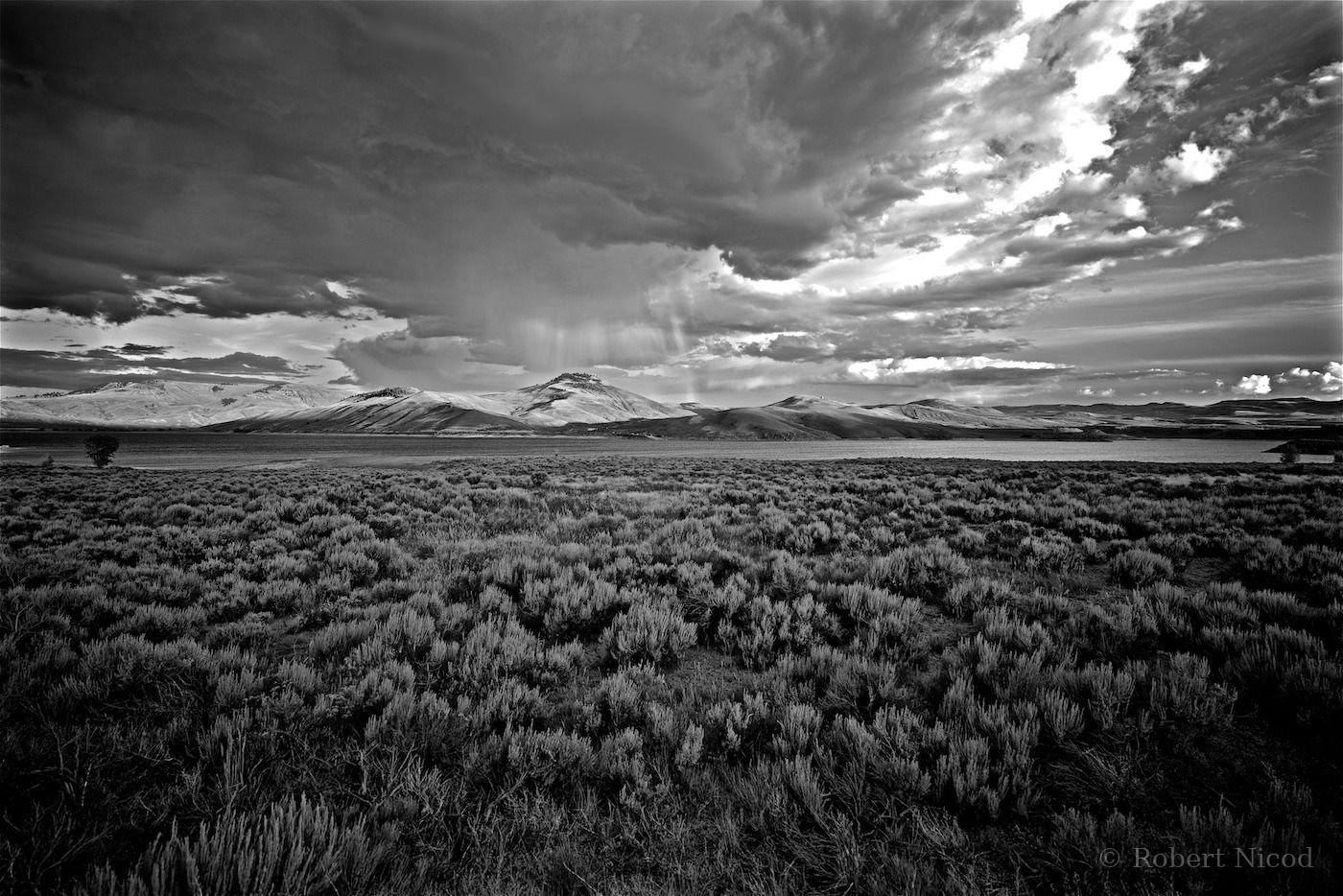 Tourists in the West — Rain over an arid prairie in Nevada
